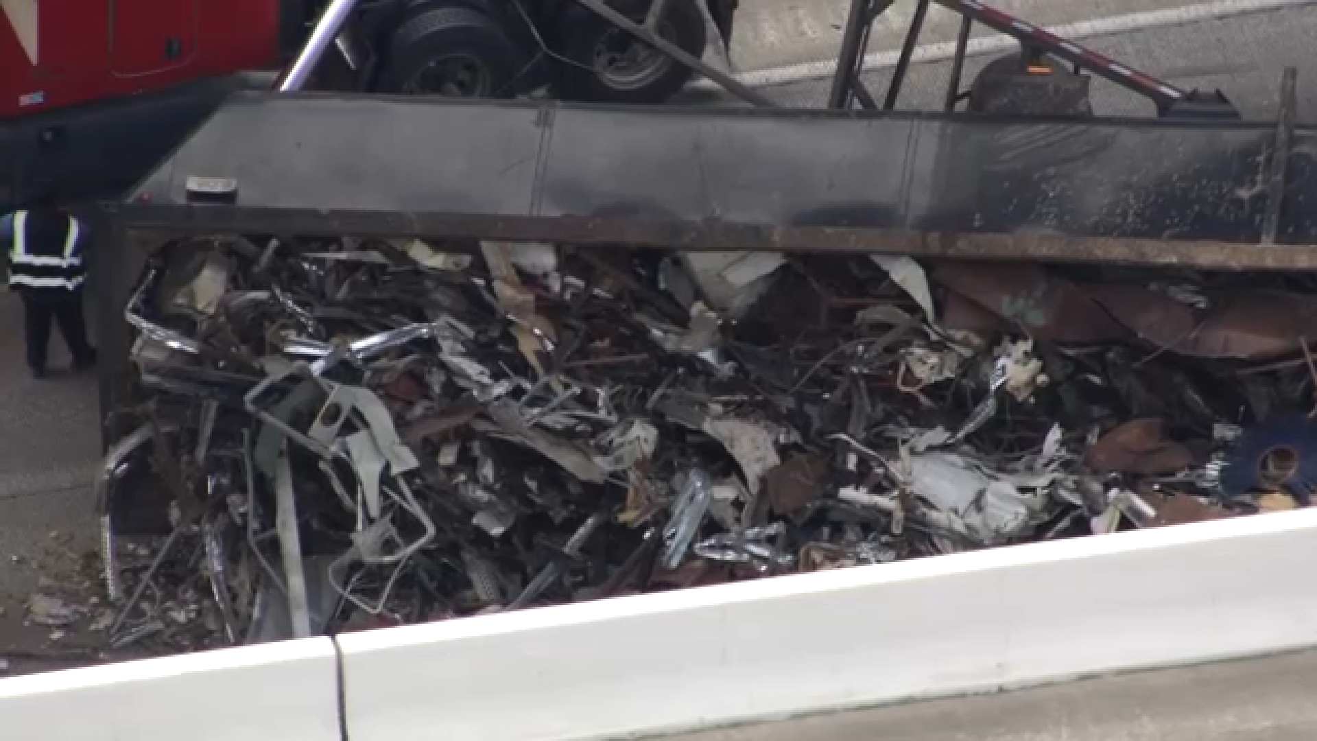 SkyEye13 was overhead at the scene, capturing images of the overturned truck carrying what appeared to be scrap metal and trash.