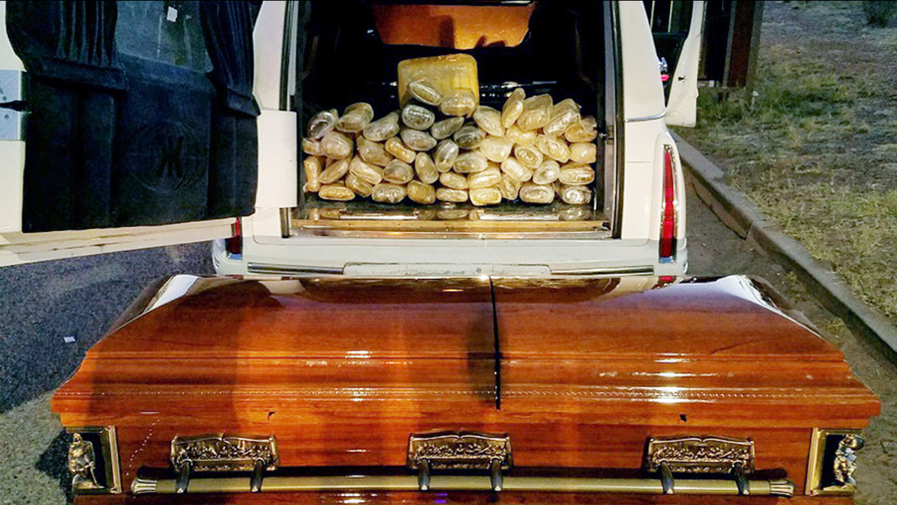 This Saturday, April 29, 2017 photo provided by U.S. Customs and Border Protection shows a hearse, the casket and the bricks of marijuana it was carrying after agents stopped the vehicle at an immigration checkpoint on State Route 80 near Tombstone, Ariz.
