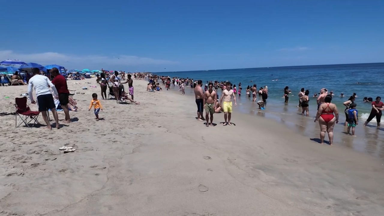 Beachgoers pack Point Pleasant Beach at the Jersey Shore on the 4th of July