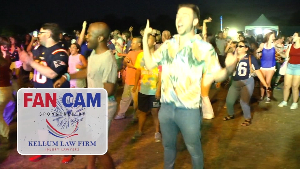 People dance and celebrate ahead of Dix Park fireworks show