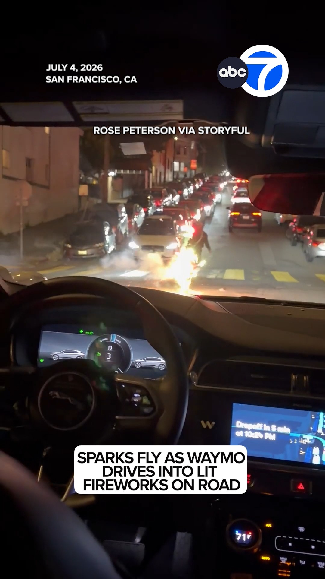 Sparks fly as Waymo drives into lit fireworks on road