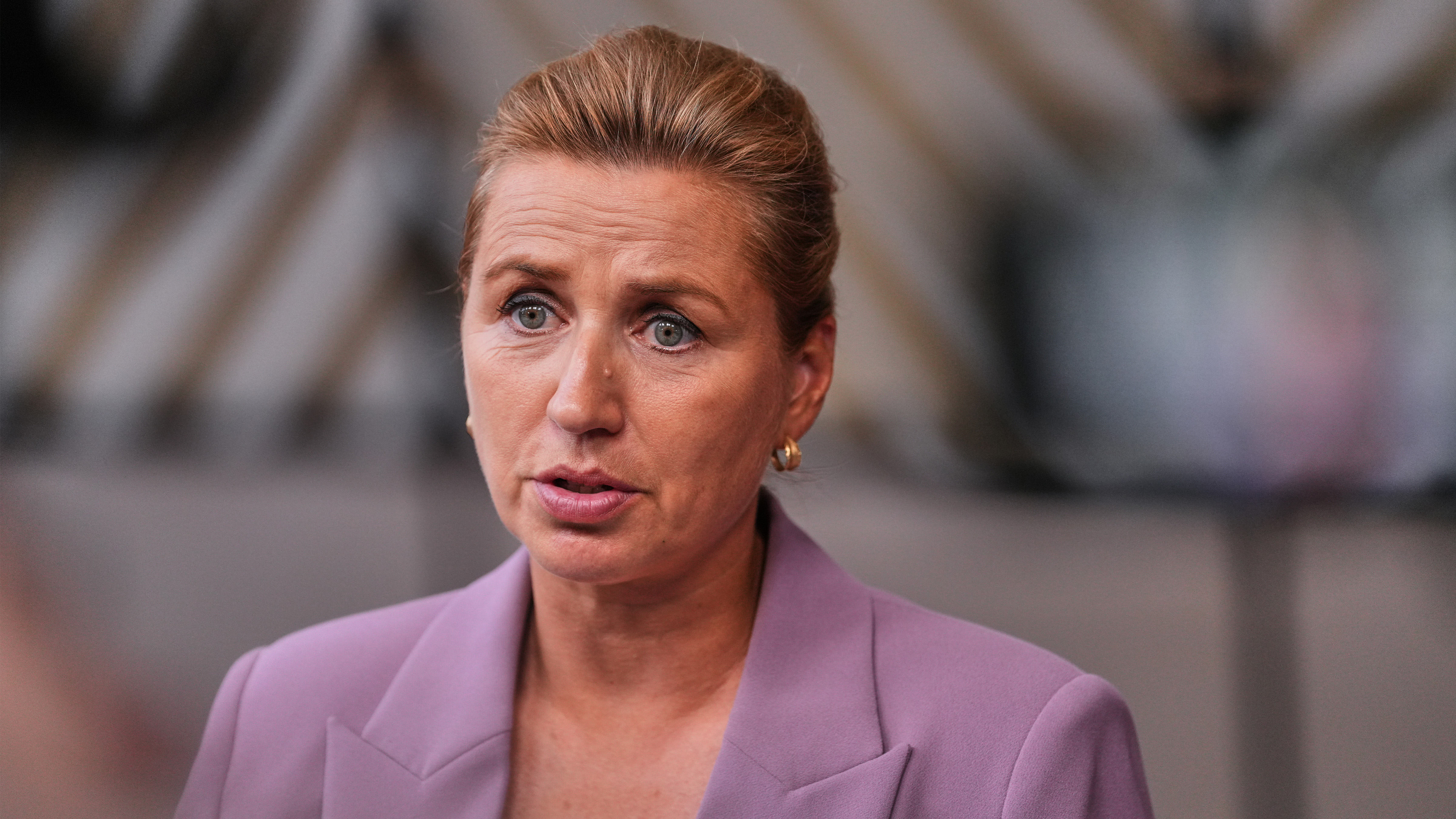 Denmark's Prime Minister Mette Frederiksen talks to journalists as she arrives for the EU summit in Brussels, Thursday, June 18, 2026. 