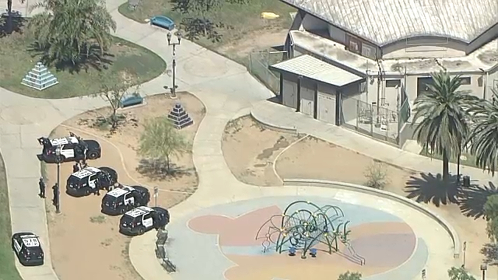 LAPD team in standoff with person barricaded in MacArthur Park restroom after possibly simulating firearm LAPD team in standoff with person barricaded in MacArthur Park restroom after possibly simulating firearm