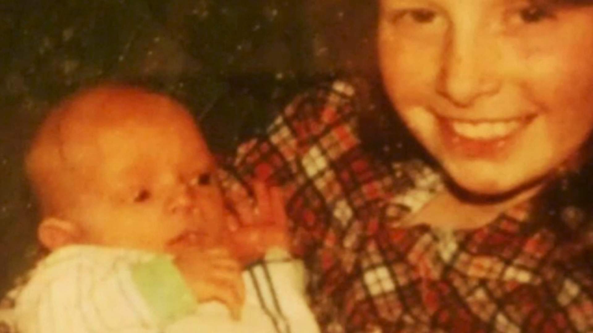 Danielle holds Patrick, then a newborn.