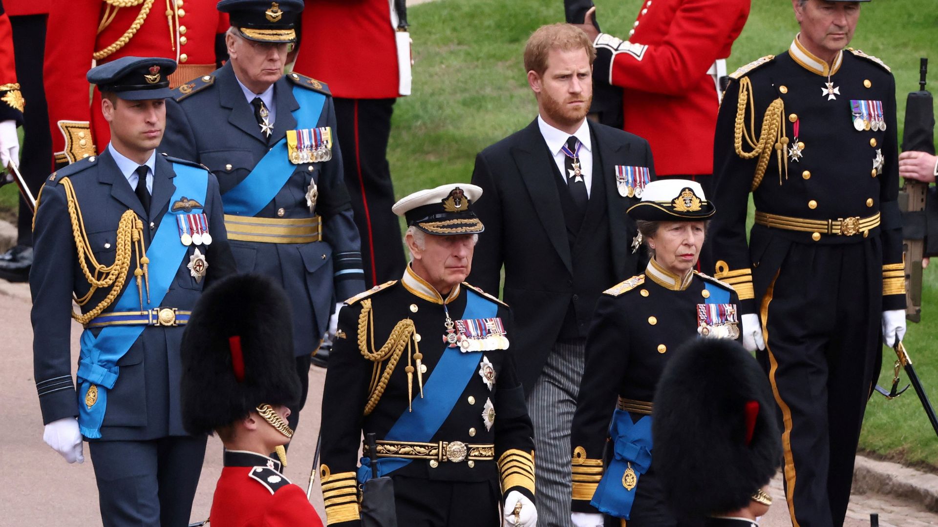 FILE - Britain's King Charles III, Princess Anne, Prince William and Prince Harry follow Queen Elizabeth II's coffin at Windsor Castle, Windsor, England in 2022.