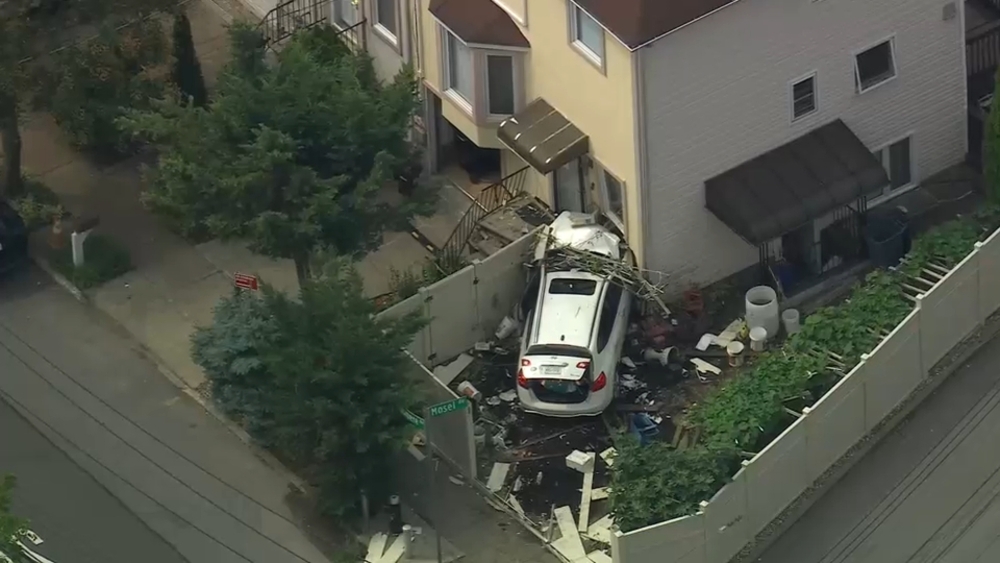 Suspected stolen SUV plows into Staten Island home; 2 in custody