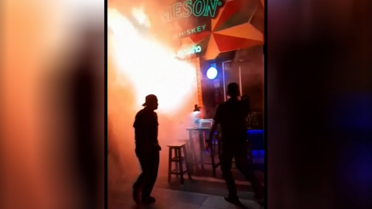 Flames burst out of Bangkok bar as inferno kills at least 27 people