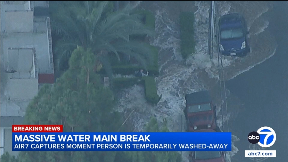 Person temporarily washed away on West Hollywood flooded street