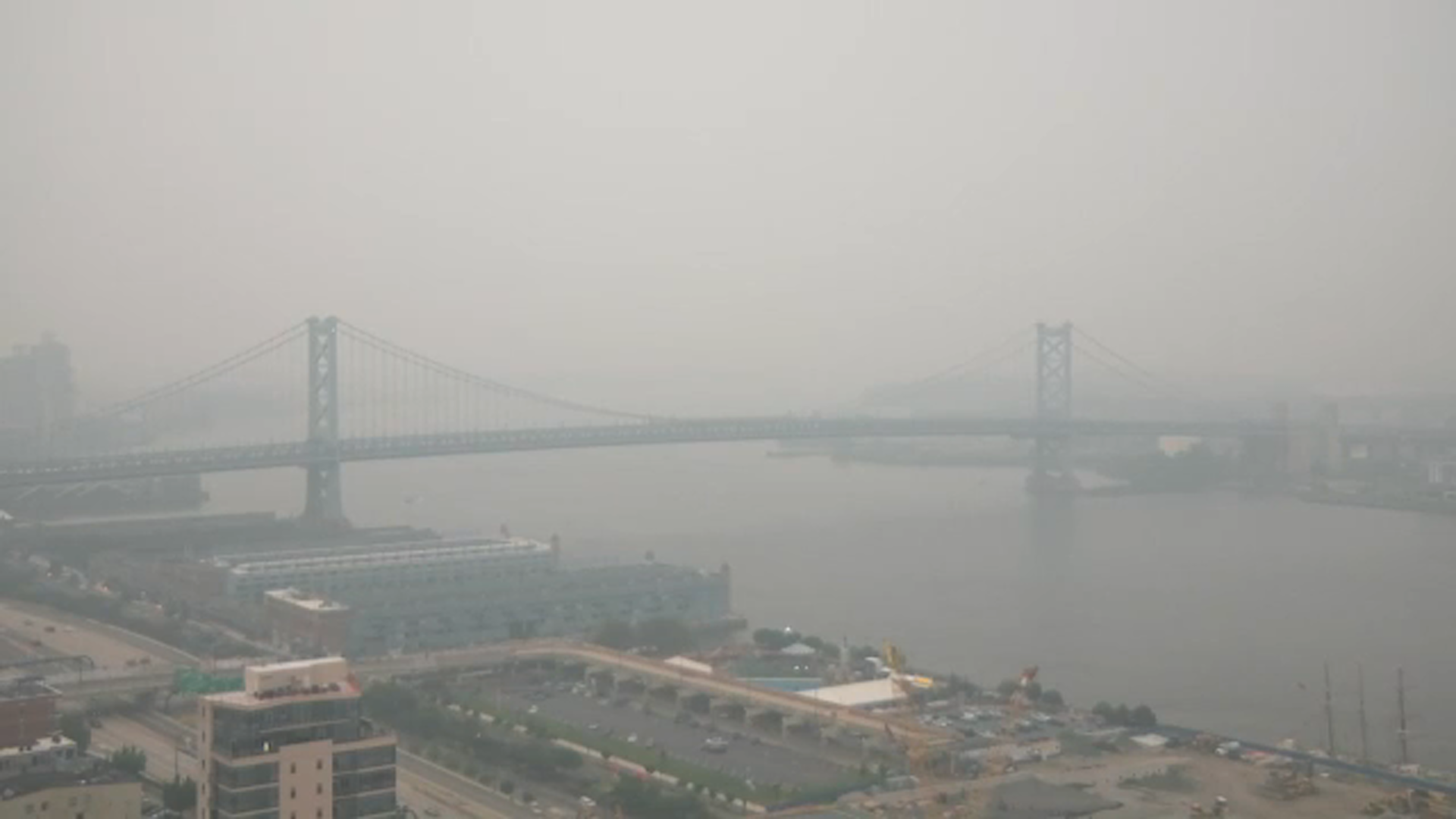 The Ben Franklin Bridge seen through the haze due to smoke from Canadian wildfires Thursday, July 16, 2026,