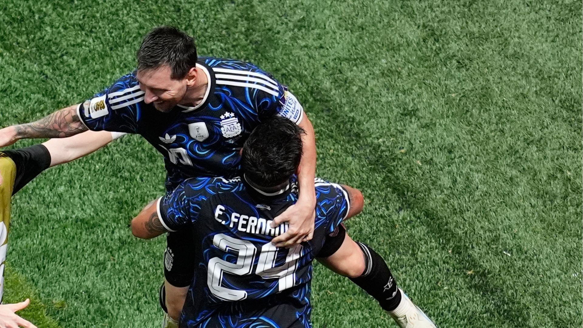 Argentina's Enzo Fernandez (24) celebrates with Lionel Messi (10) after Lautaro Martinez scored the team's second goal during the World Cup semifinal soccer match between England and Argentina in Atlanta, Wednesday, July 15, 2026.