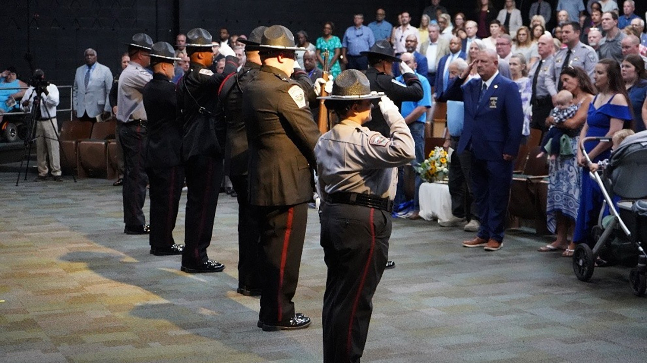 Members of the Chatham County Sheriff's Office Honor Guard render a final salute to Sheriff Mike Roberson at the conclusion of his retirement ceremony on Wednesday.