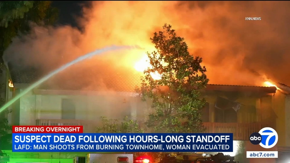 Suspect dead after hourslong barricade escalates to house fire