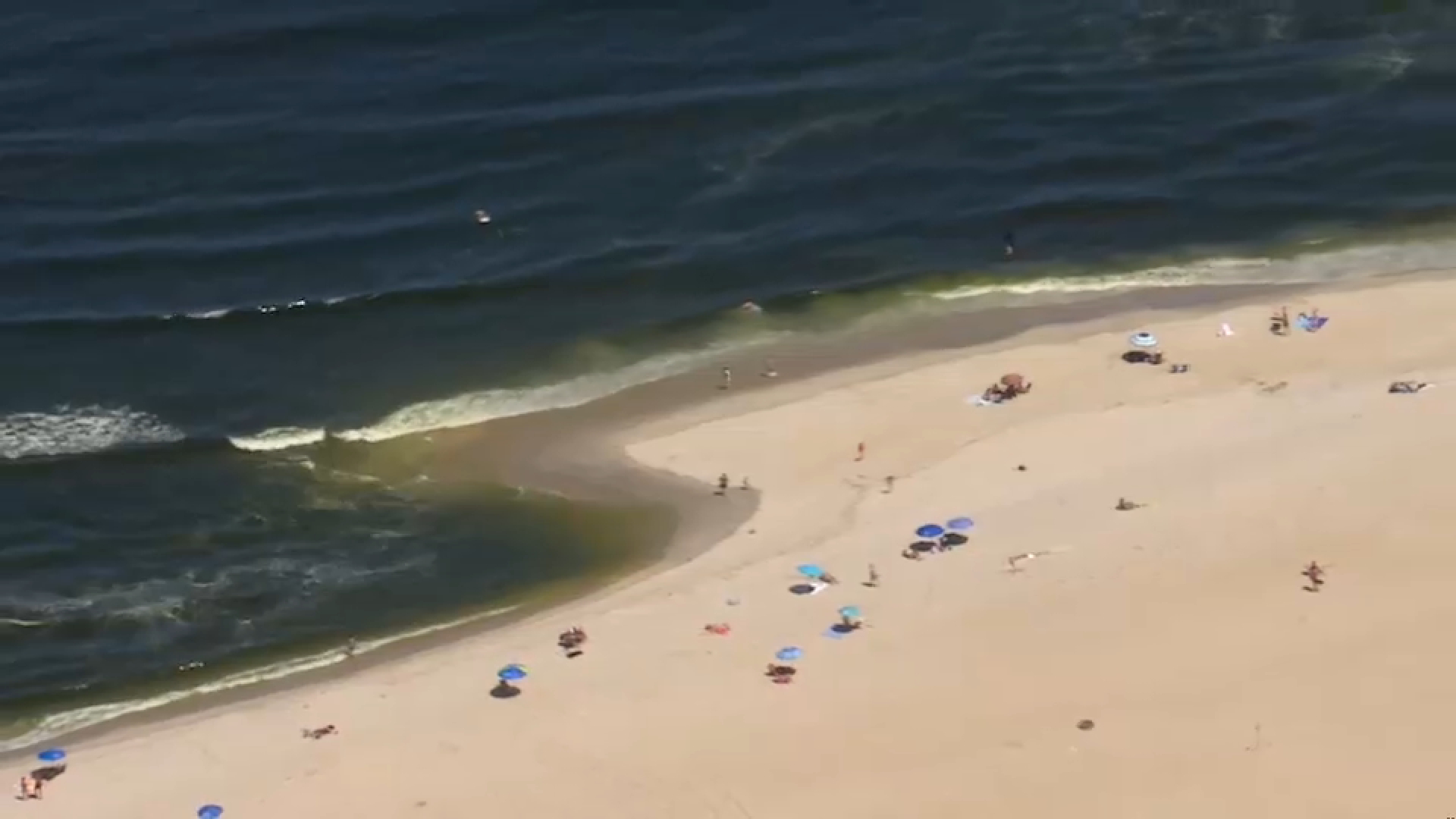 Bystanders help pull swimmer out of water at Sandy Hook Beach