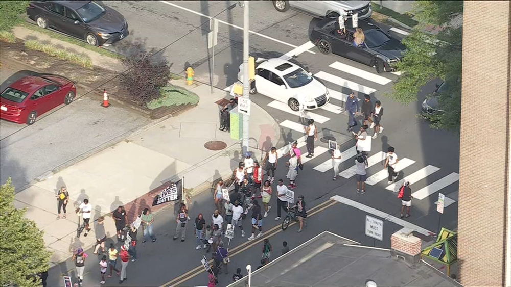 Protesters marching through Wilmington in response to police shooting