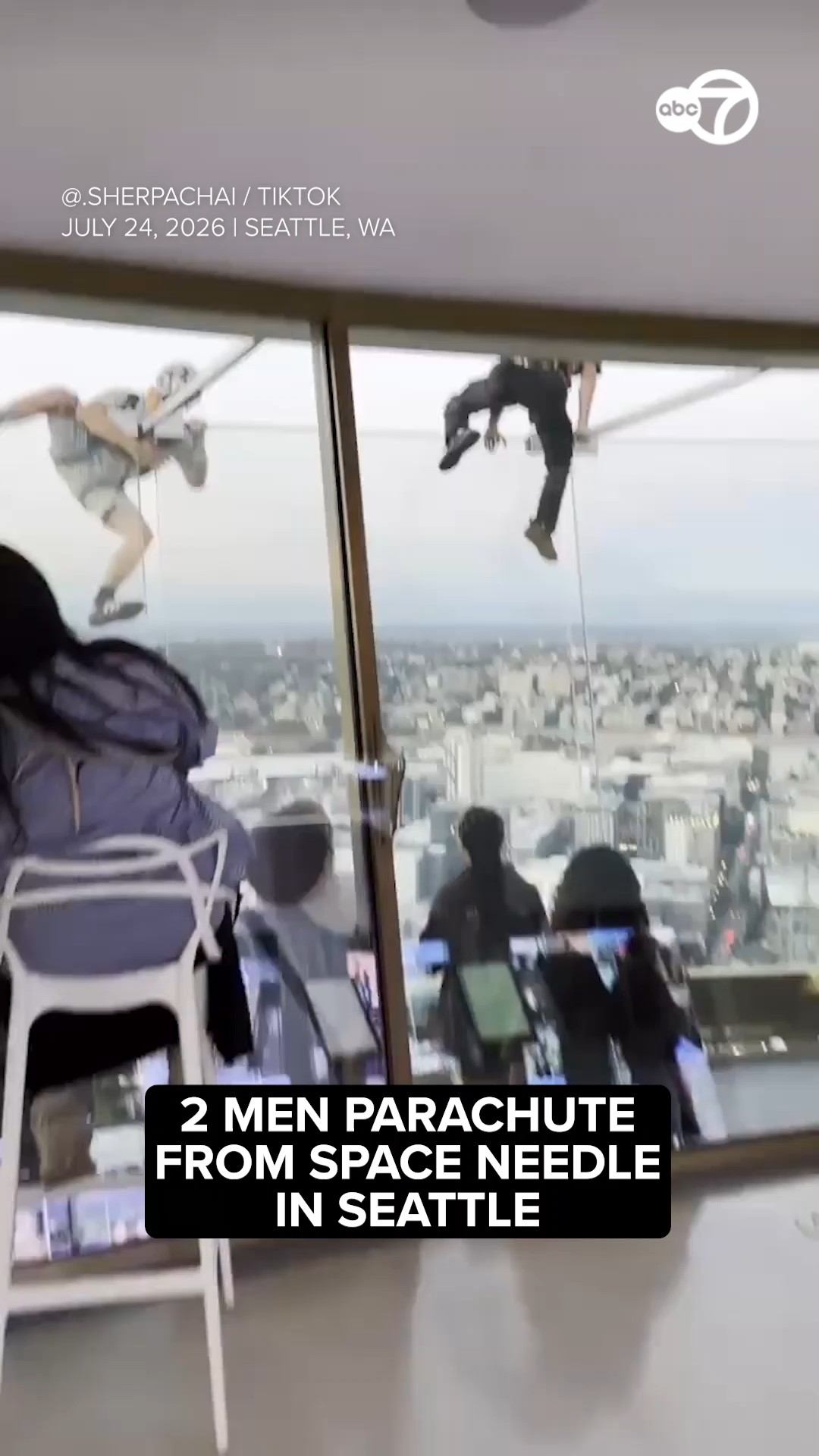 2 men parachute from Space Needle in Seattle