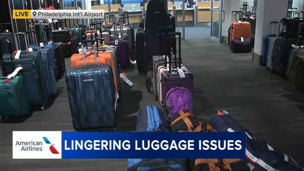 AA tells travelers to come pick up luggage from PHL after IT, weather issues