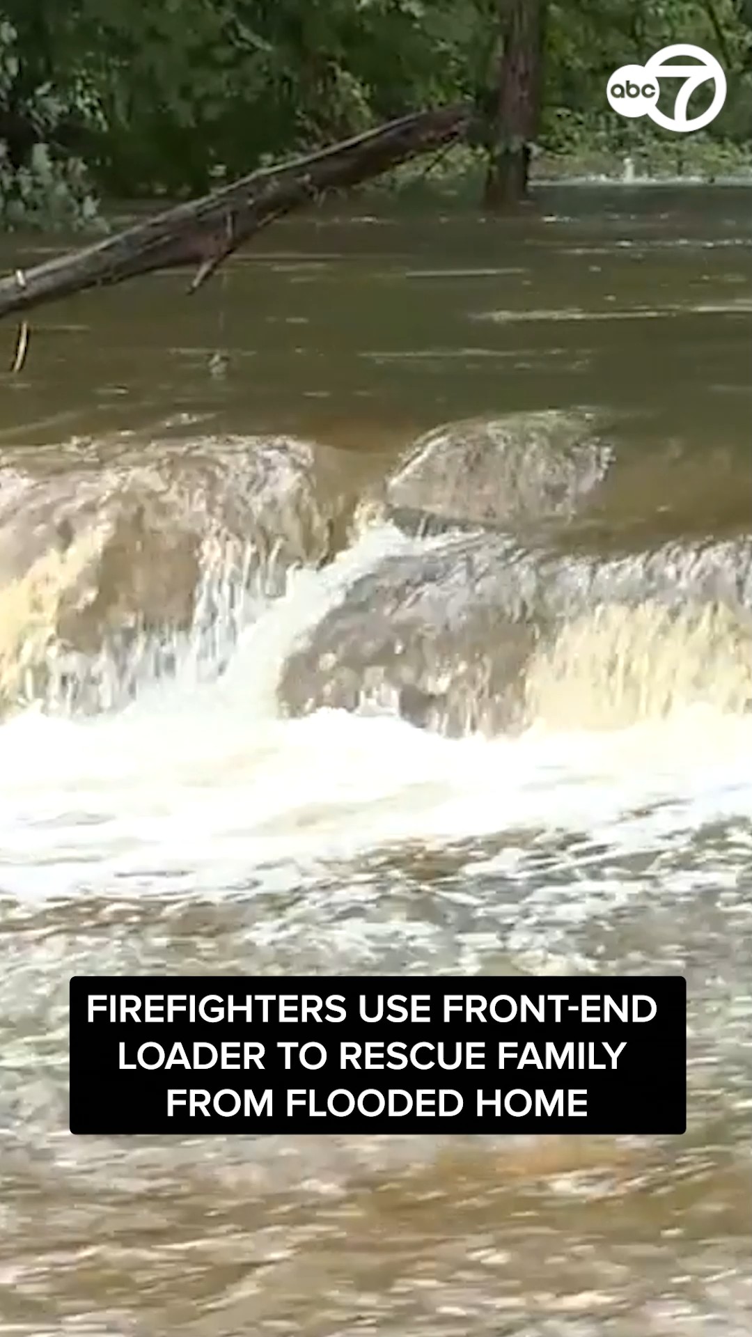 Family rescued from flooded home using front-end loader