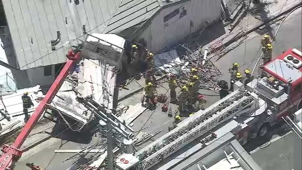 Driver rescued after truck slams into building in Pacific Palisades