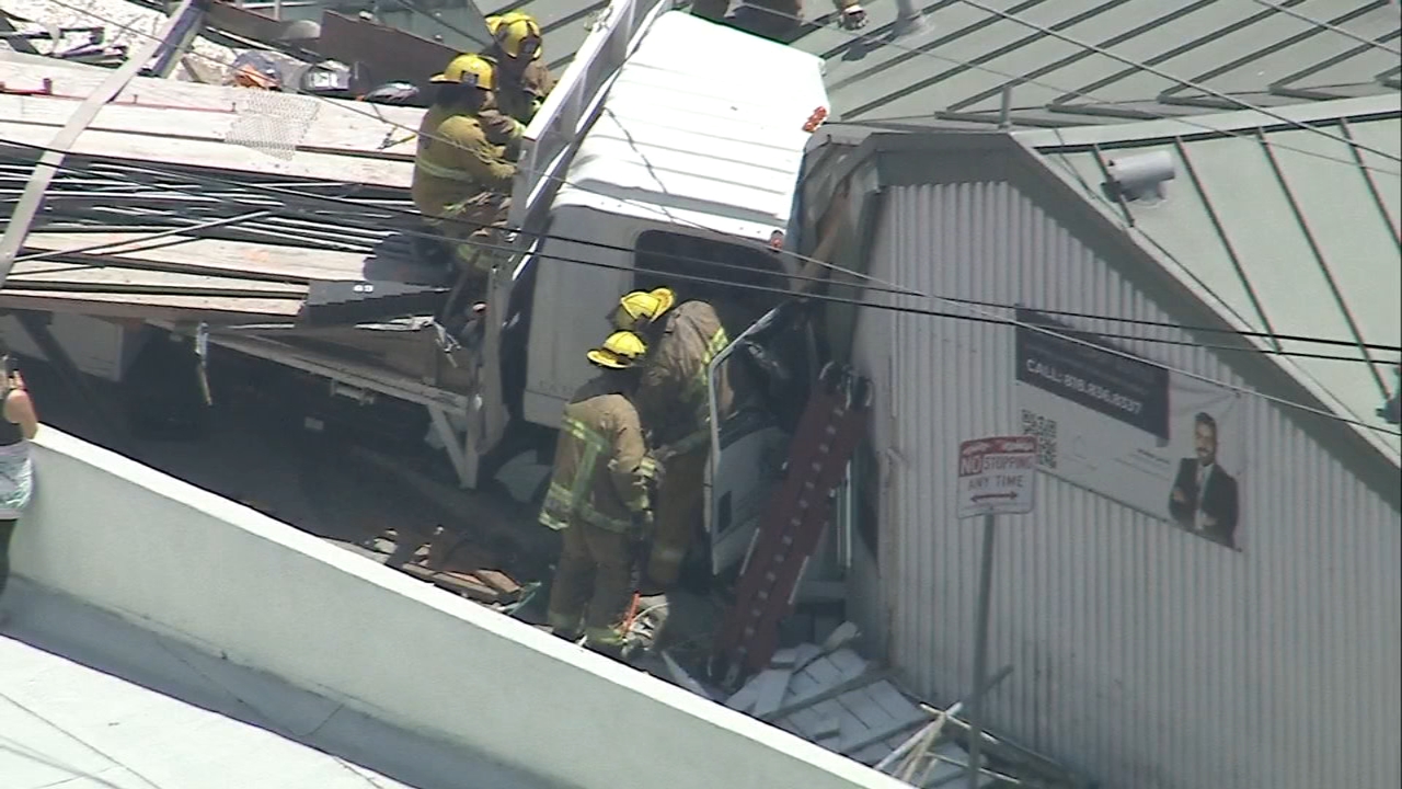 Driver rescued after truck slams into building in Pacific Palisades