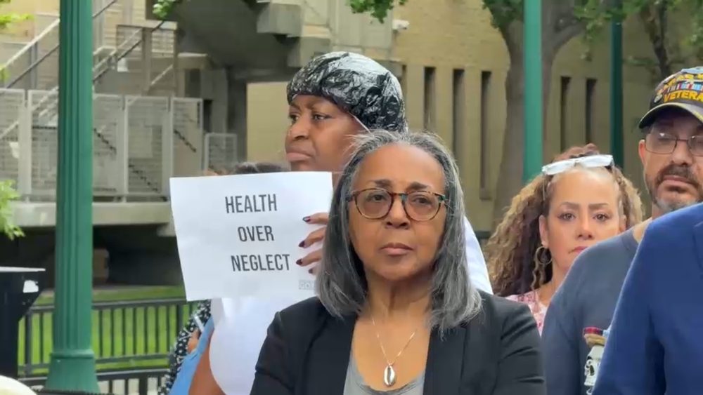 Residents rally after water inside East Village building brought into question