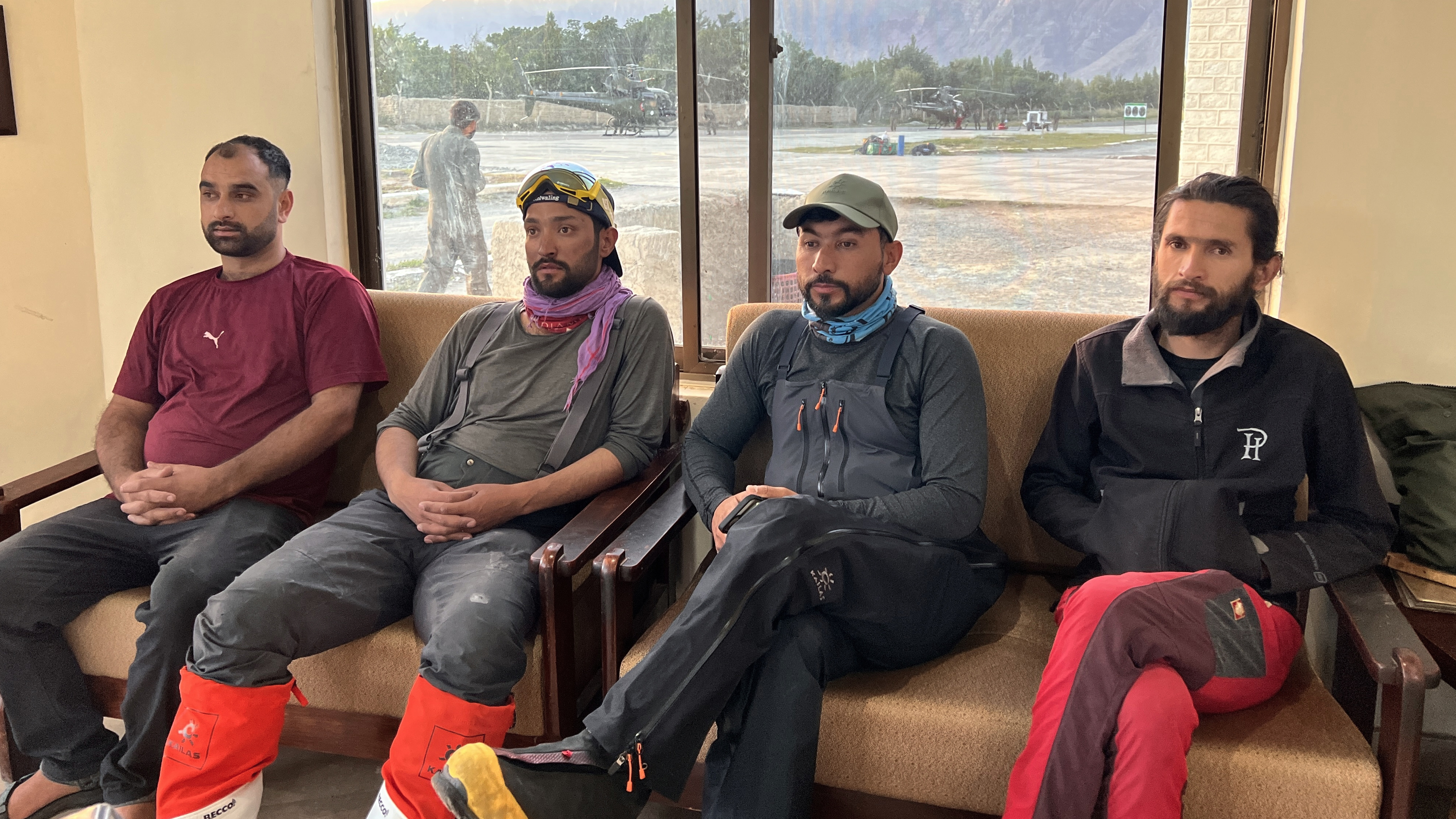 In this photo, members of a mountaineers rescue team prepare to depart from an airbase on a search operation for climbers missing after an avalanche on Pakistan's Broad Peak, in Skardu, in Gilgit-Baltistan's region, in northern Pakistan.