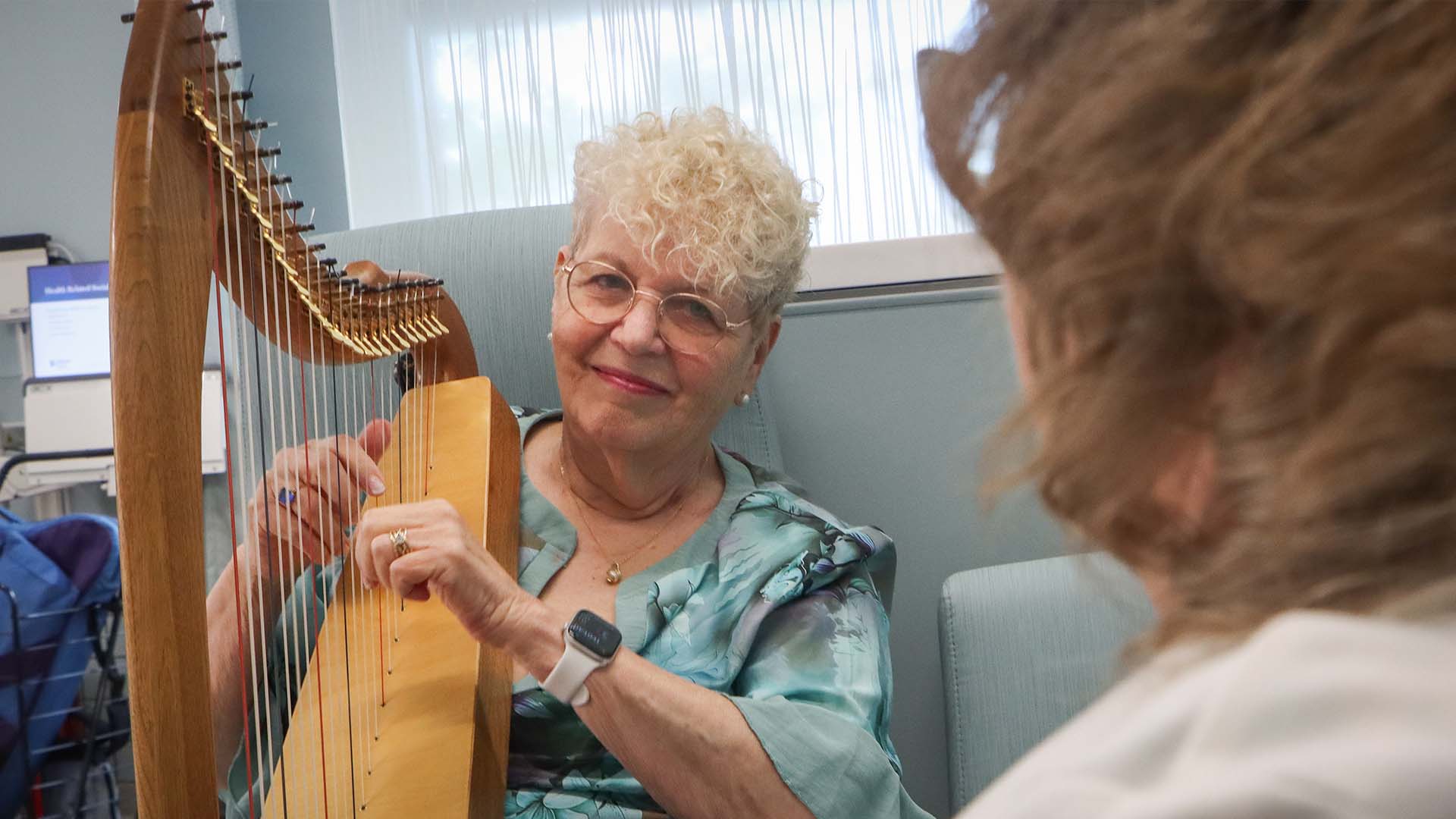 Musician gives hospital patients hope with the sound of the harp