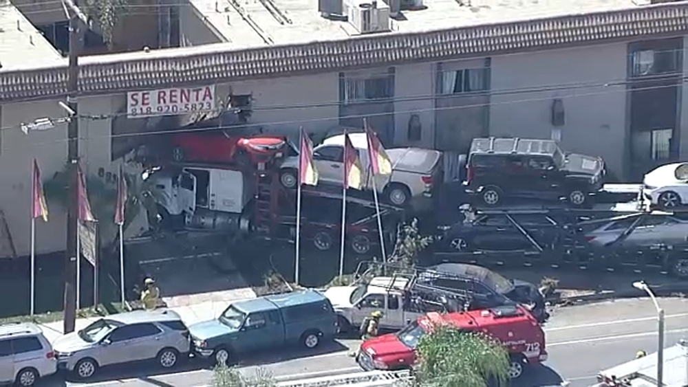 Car hauler crashes into Panorama City apartment building