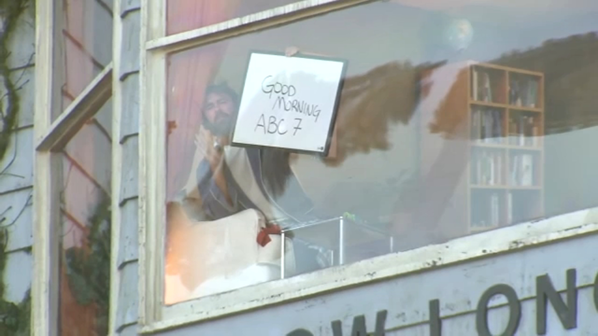 Man living inside billboard on Sunset Boulevard to promote film draws spectators