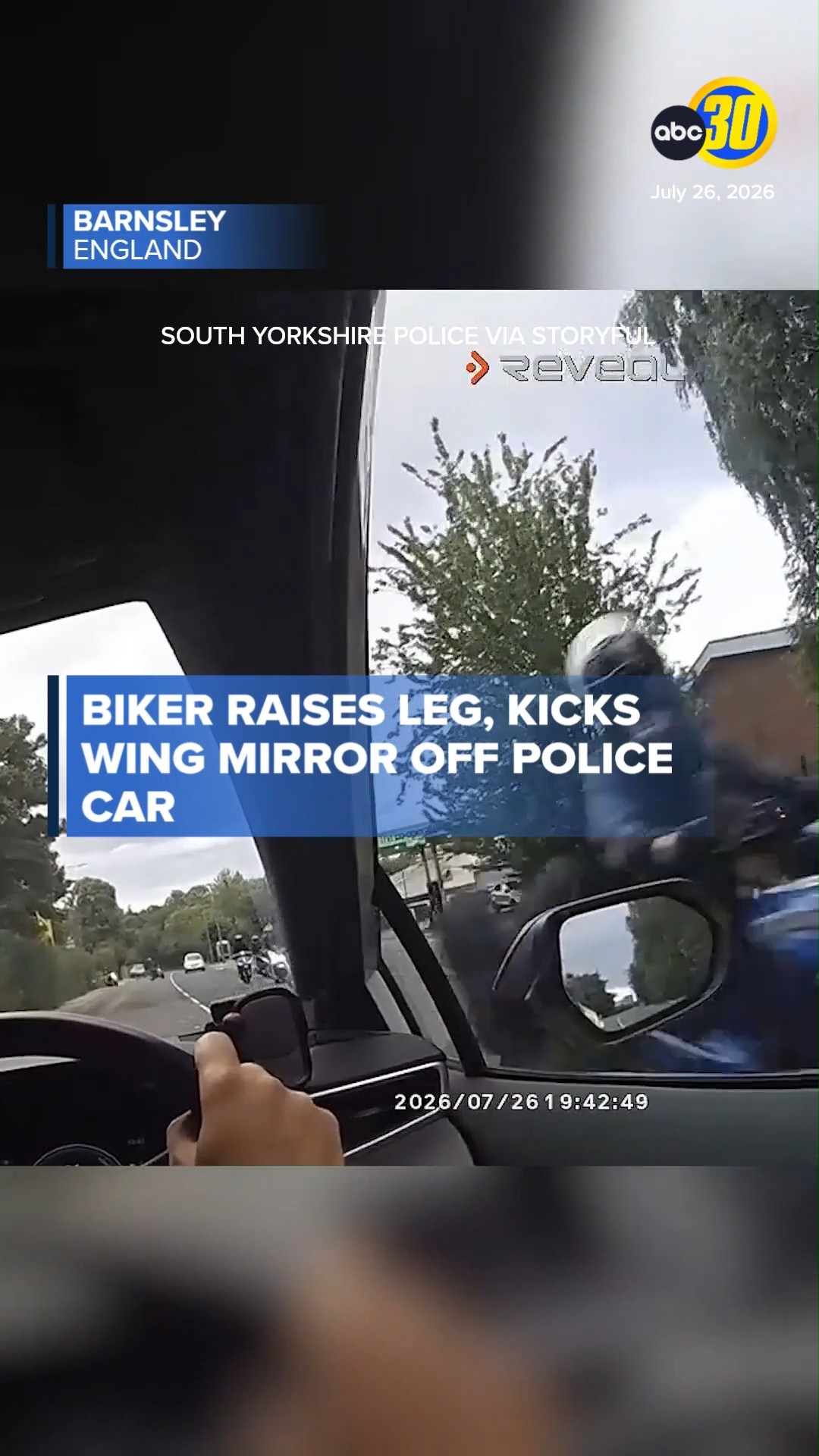 Biker kicks wing mirror off police car