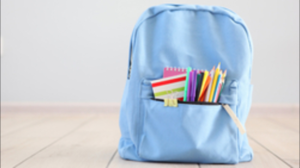 Duke basketball player joins Durham backpack giveaway