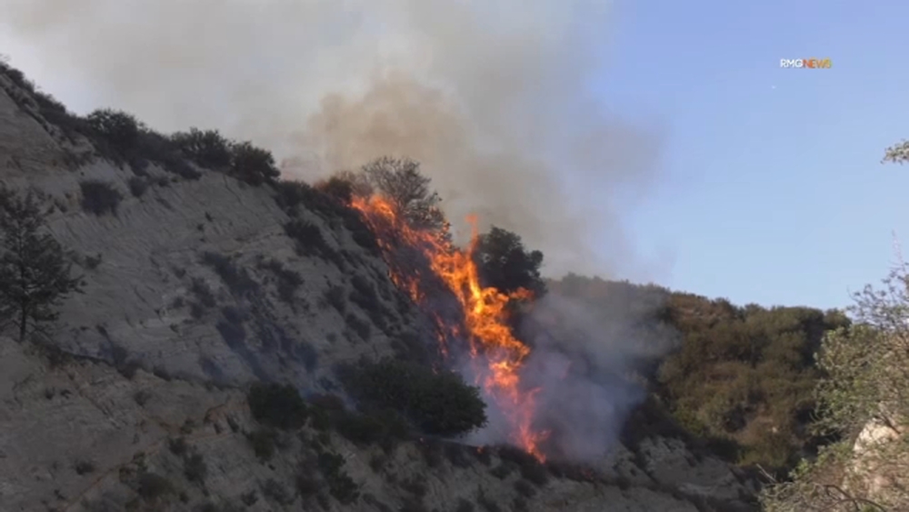 Evacuation warnings remain for fast-moving fire in Santa Clarita