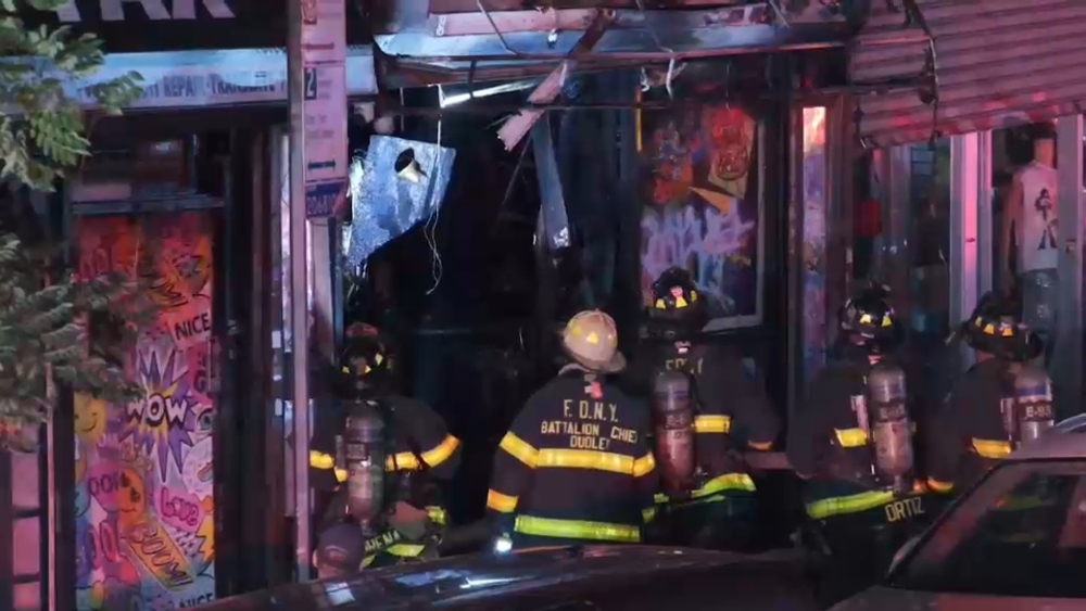 Flames rip through Bronx stores; worker rescued but badly burned
