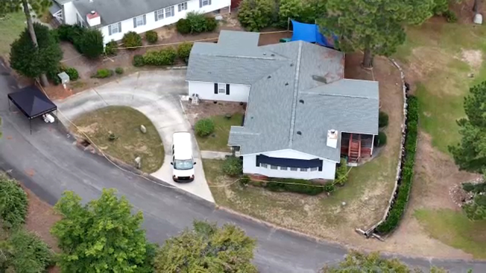 Drone 11 over the scene of where deputies discovered three people dead inside this home.