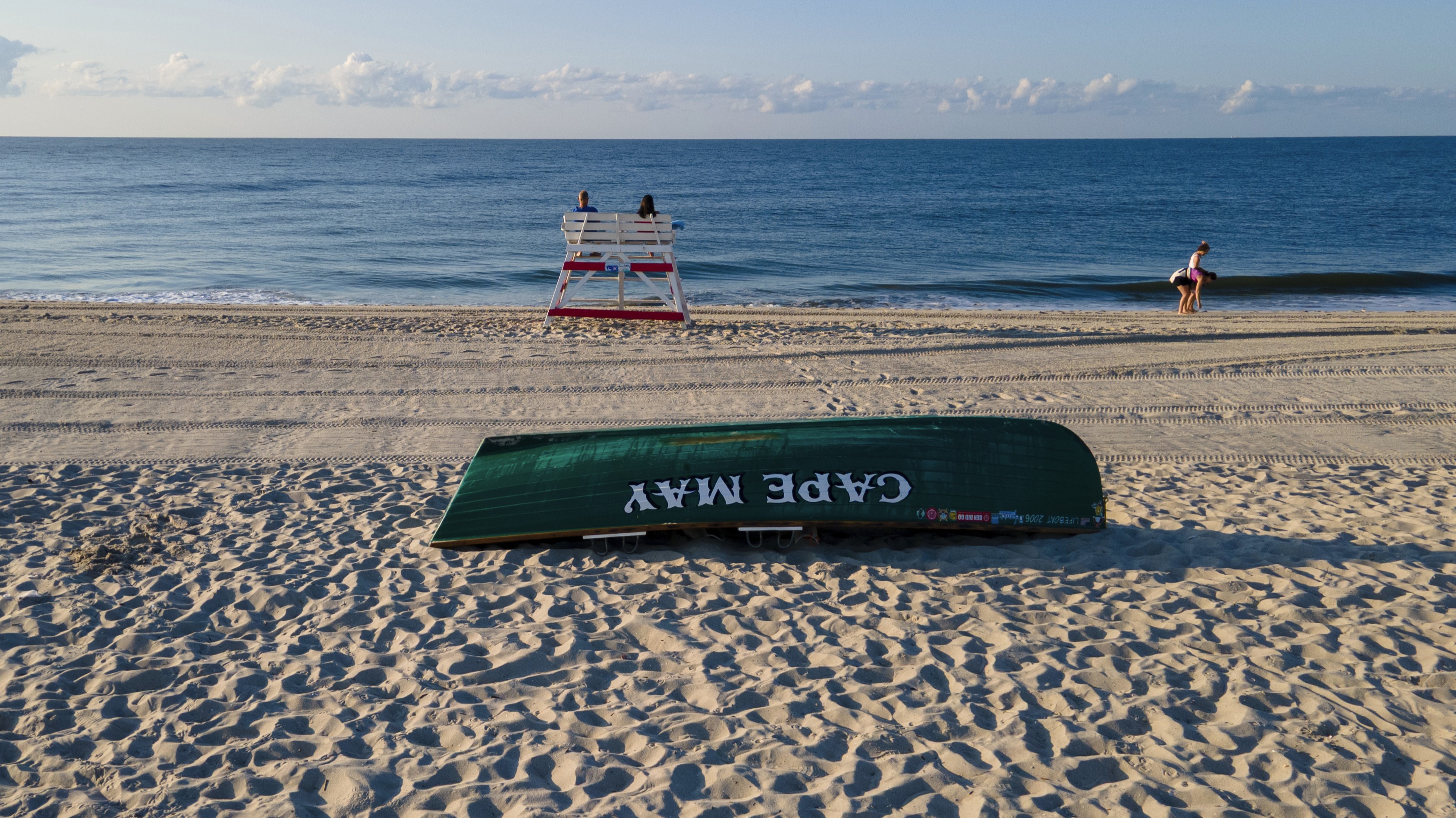 People are on the beach in Cape May, N.J. on Sunday, Aug. 3, 2025.