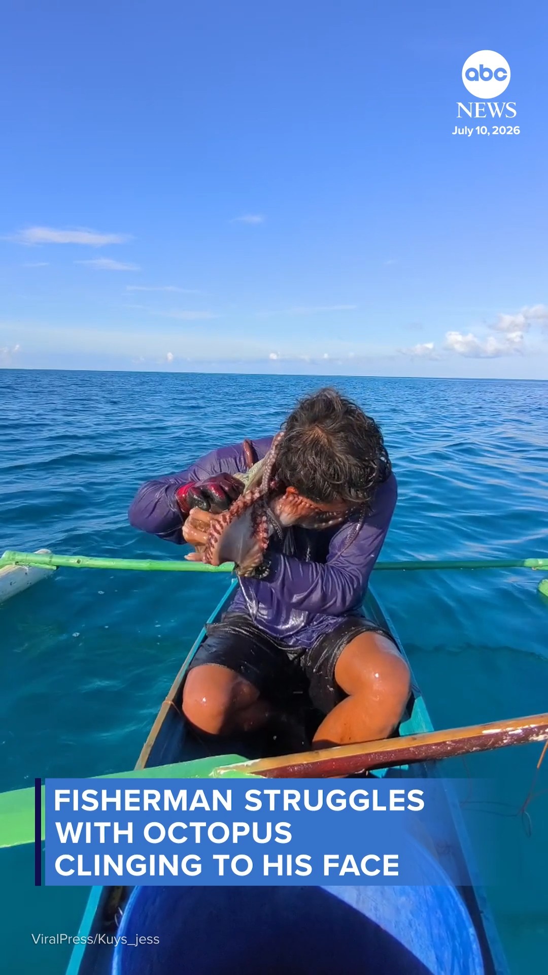 Fisherman struggles with octopus clinging to his face
