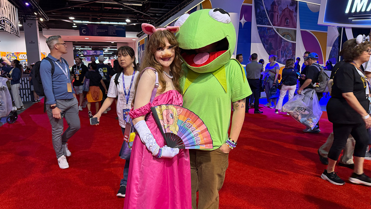 Guests dress up as "The Muppets" characters Miss Piggy and Kermit the Frog at D23 in Anaheim, Calif. on Friday, Aug. 14, 2026.