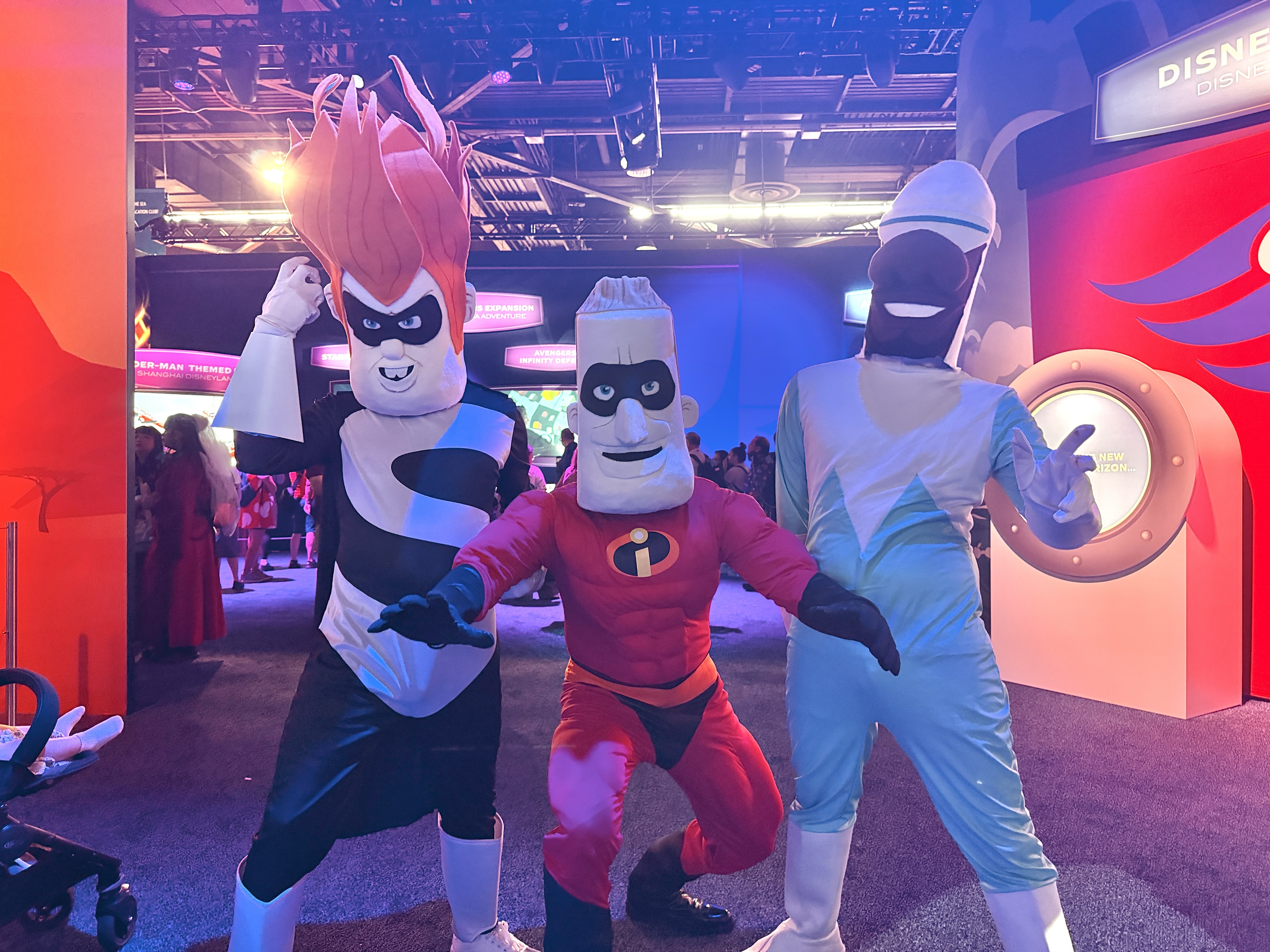 D23 attendees are seen in costume as as "Incredibles" characters Mr. Incredible, Syndrome and Frozone in Anaheim, Calif. on Friday, Aug. 14, 2026.