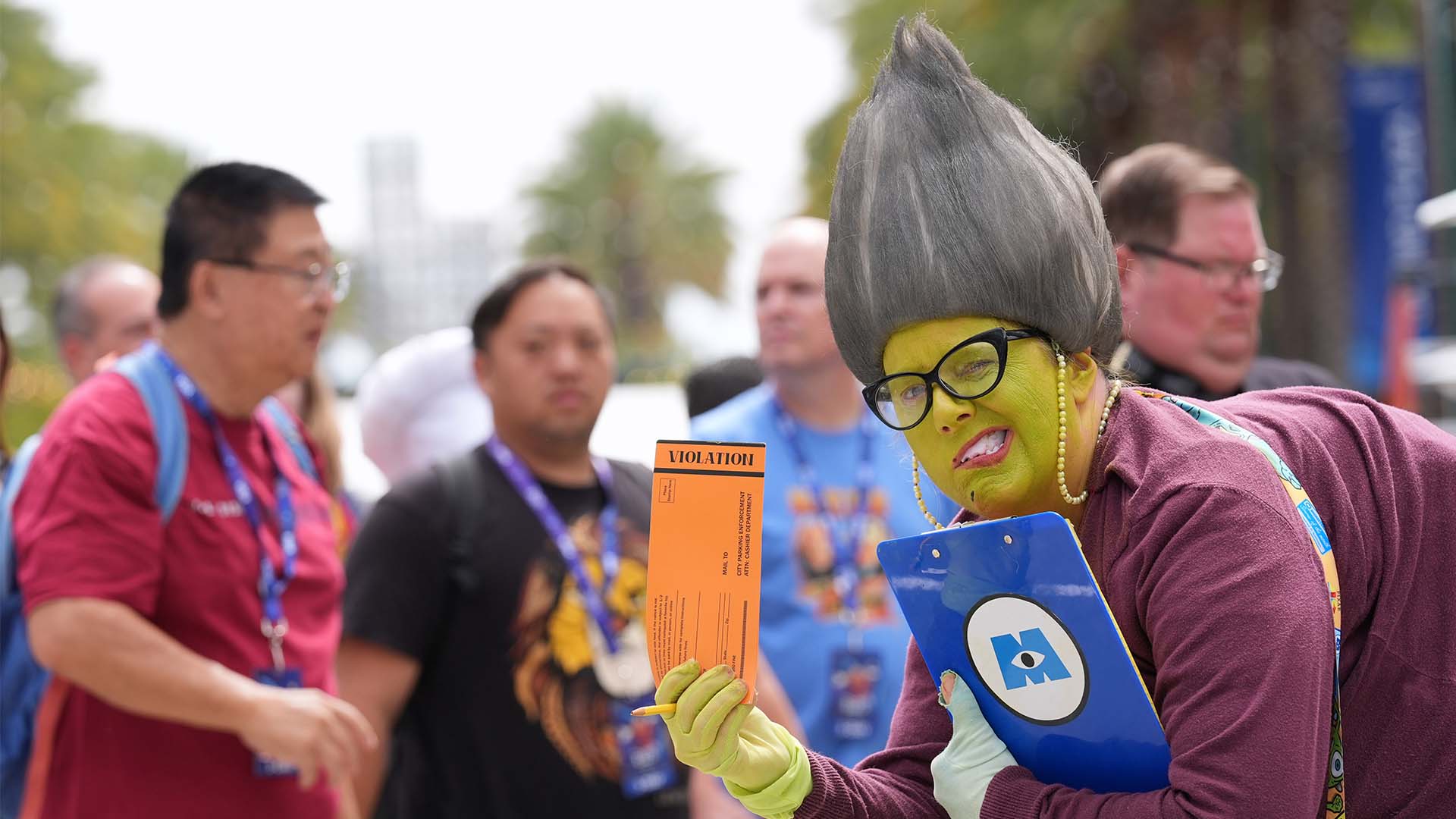 Andrea Seale of Burbank, Calif., dressed as the character Roz from the animated film "Monsters, Inc.," strikes a pose during D23 on Aug. 14, 2026 in Anaheim, Calif.