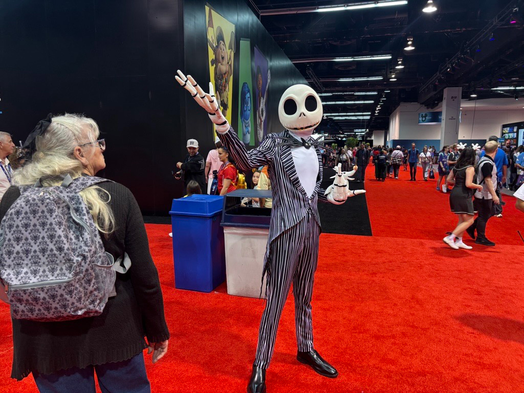 A D23 attendee is seen dressed as Jack Skellington with his best boy, Zero, at D23 in Anaheim, Calif. on Friday, Aug. 14, 2026.