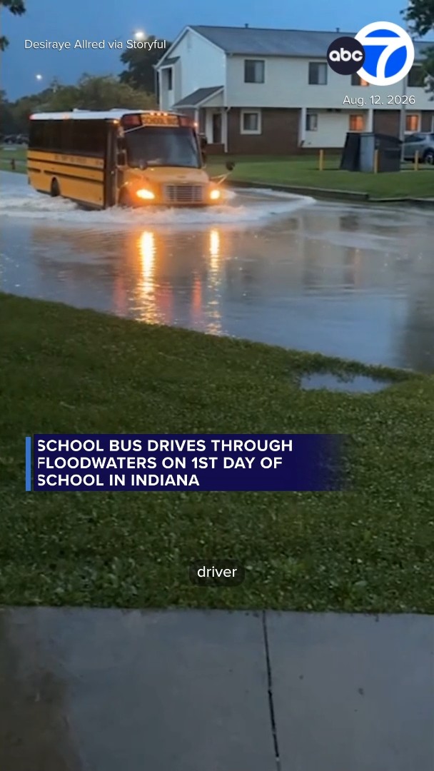 School bus drives through floodwaters on 1st day of school