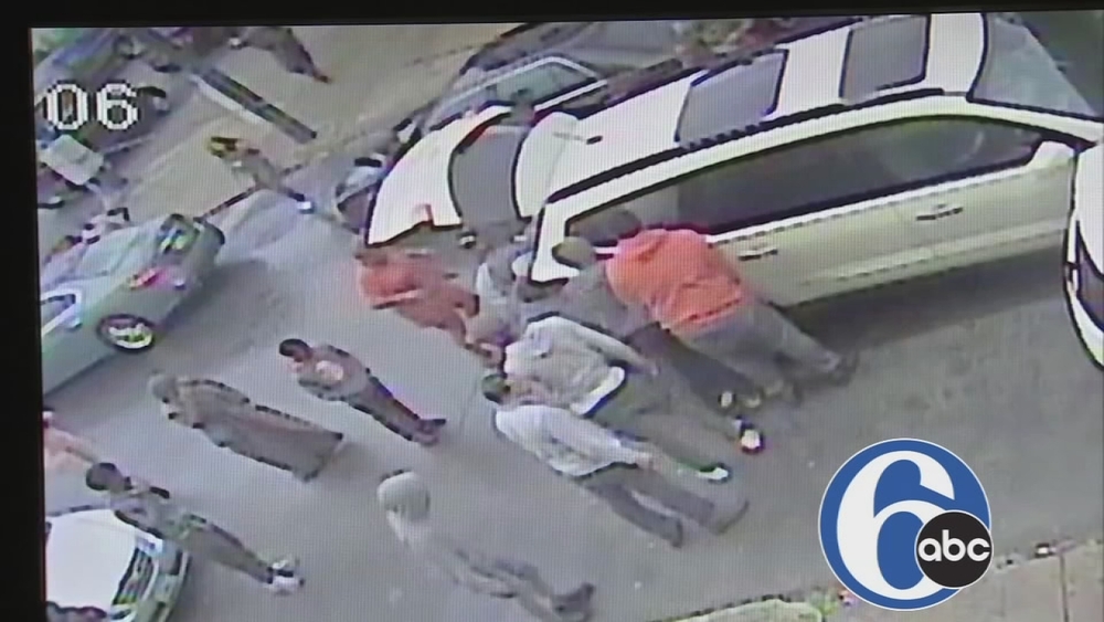 Raw video: Bystanders lift vehicle off child