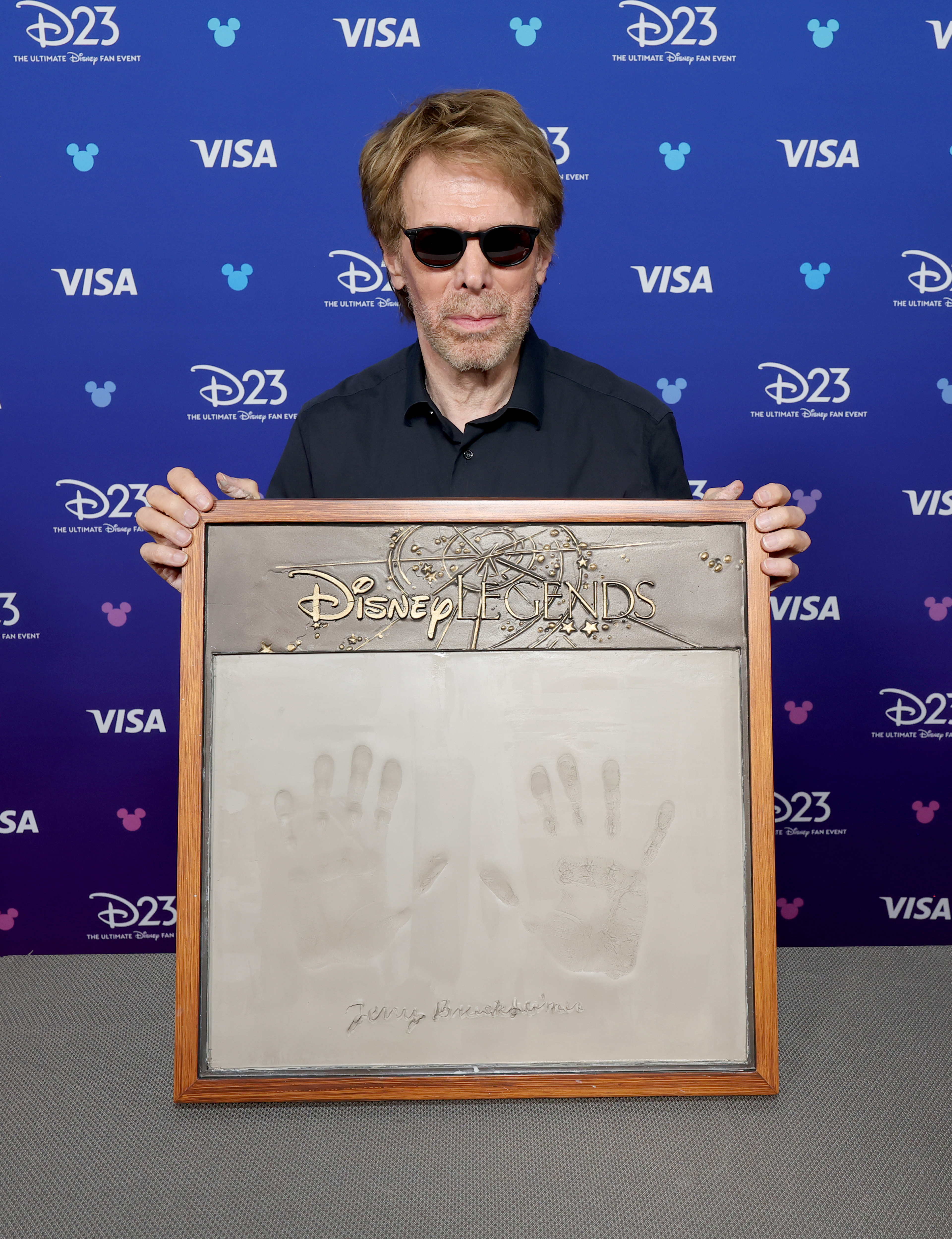 Jerry Bruckheimer gets his handprints done at D23 on August 16, 2026 in Anaheim, California.