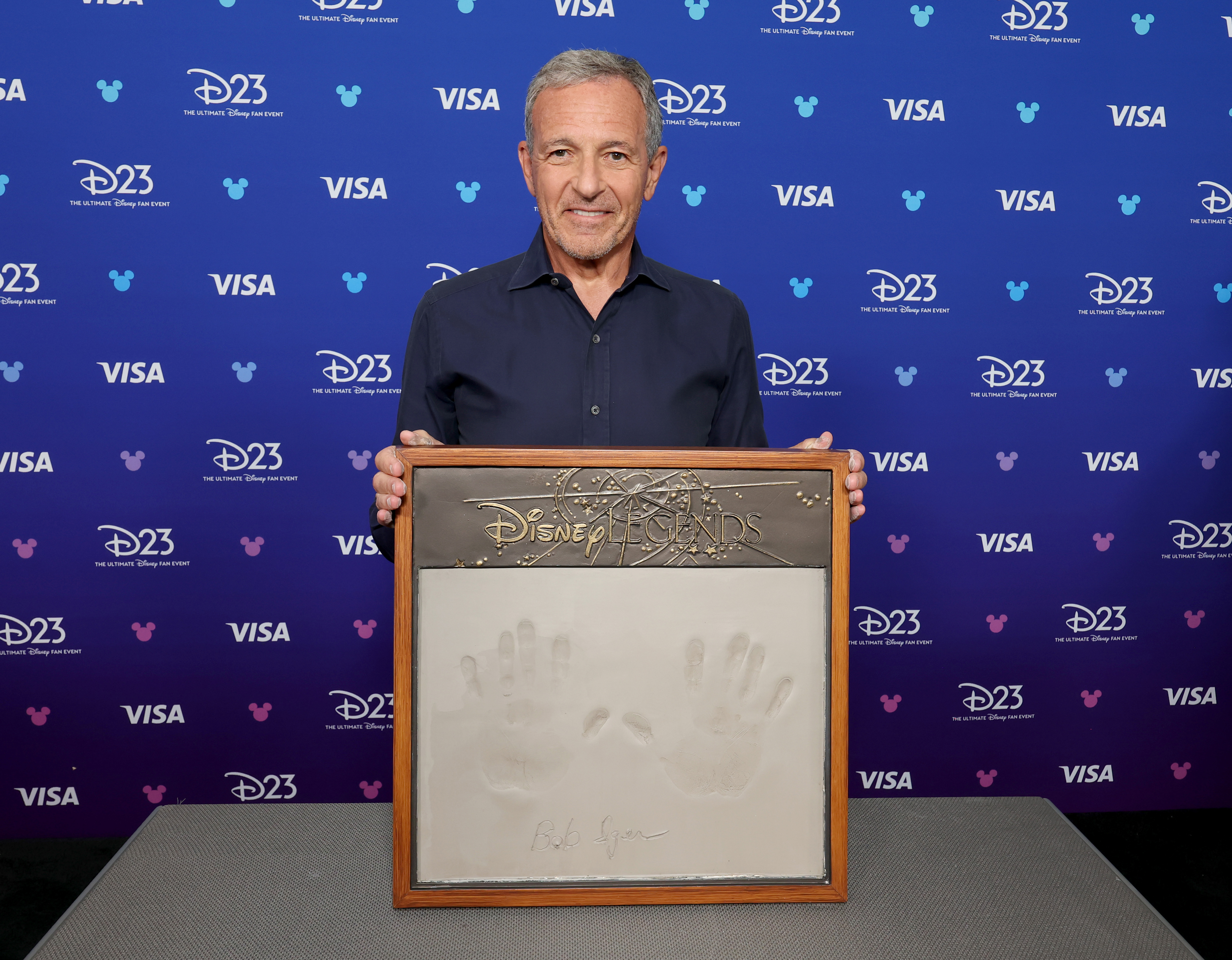 Bob Iger, Former CEO, The Walt Disney Company gets his handprints done at D23 on August 16, 2026 in Anaheim, California.