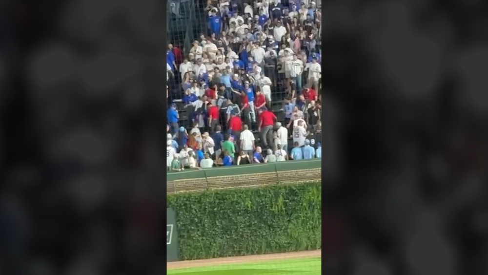 Fans escorted out of Wrigley Field