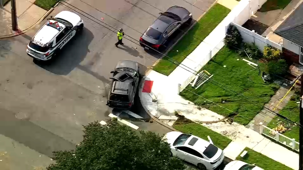 SUV rolls over into Queens home
