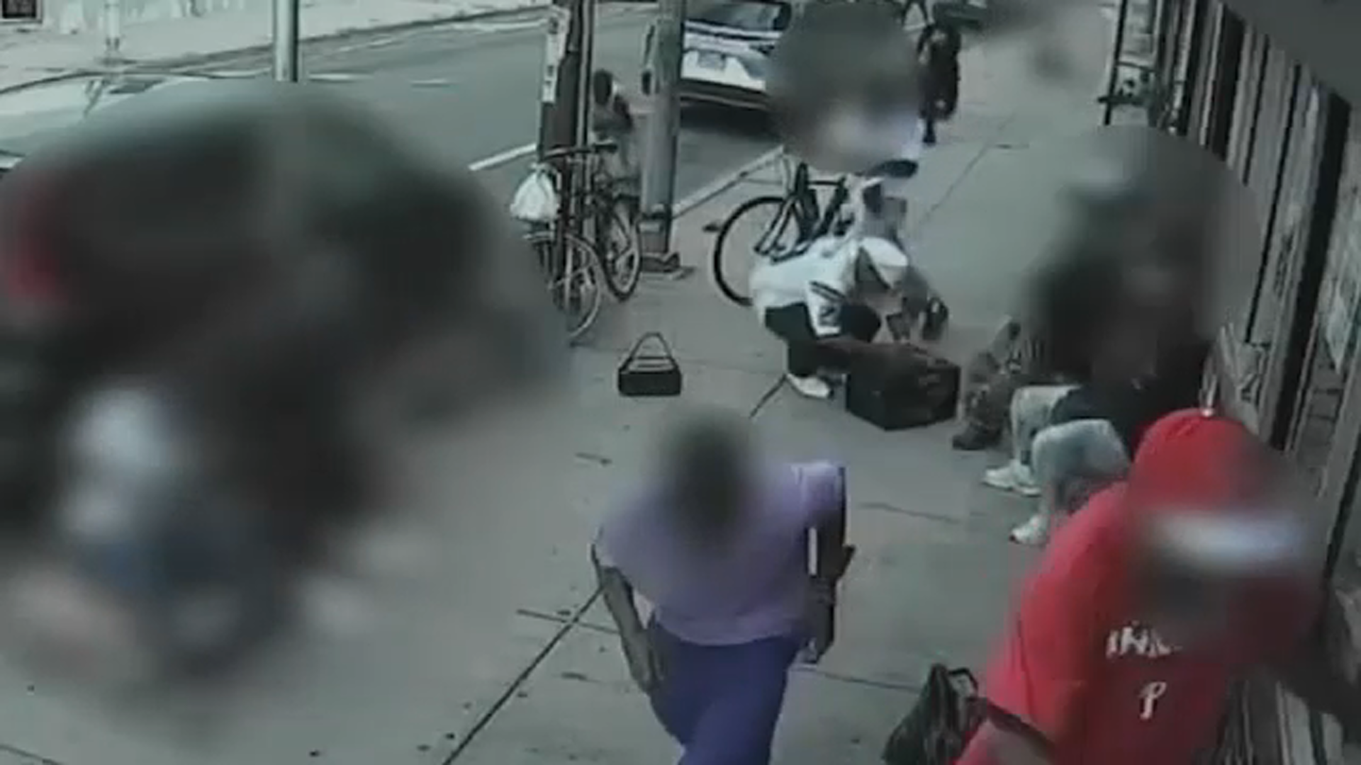 IMAGE: A video screenshot shows people running for safety after four gunmen opened fire in North Philadelphia on Aug. 18, 2026.