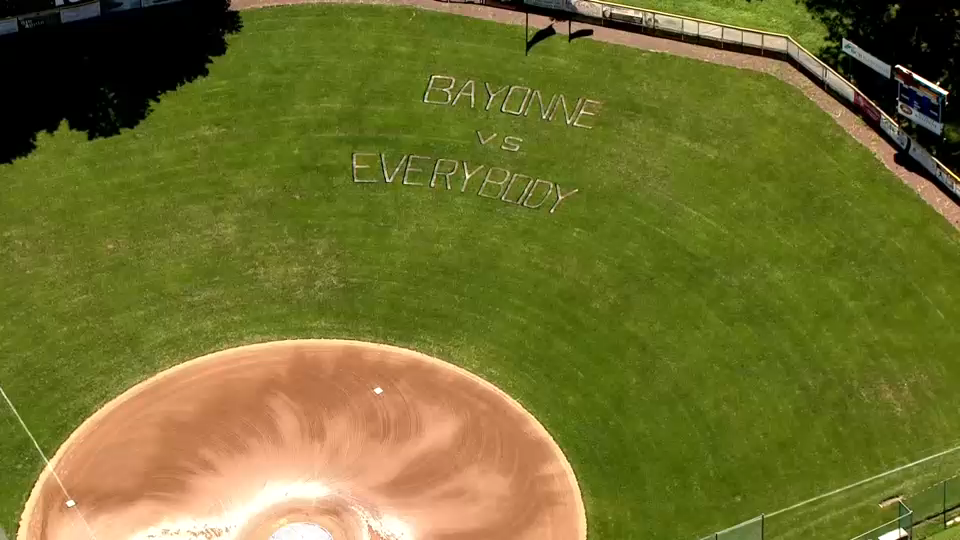 News Copter 7 was over Bayonne's home baseball field where the team's motto---"Bayonne Versus Everyone"---is spelled out in the outfield's grass.