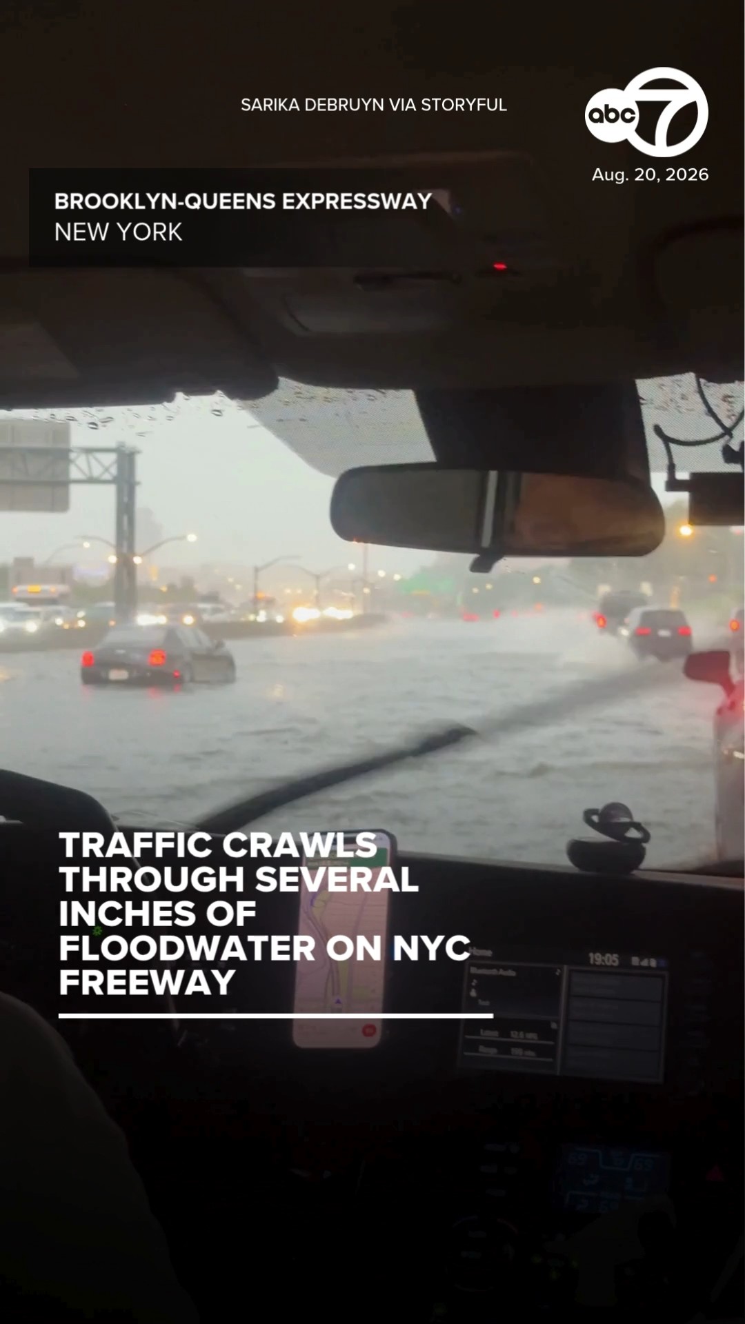 Traffic crawls through several inches of floodwater on NYC freeway
