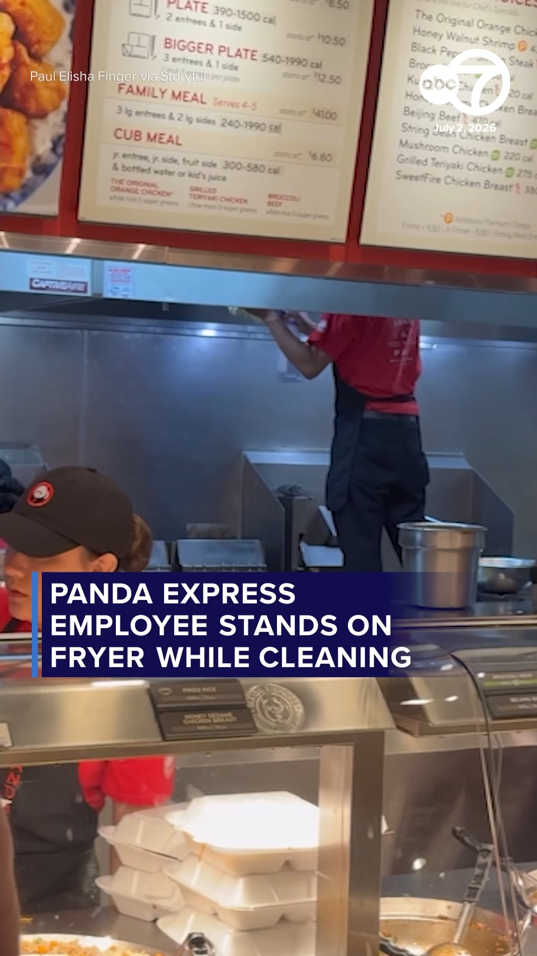 Panda Express employee stands on fryer while cleaning