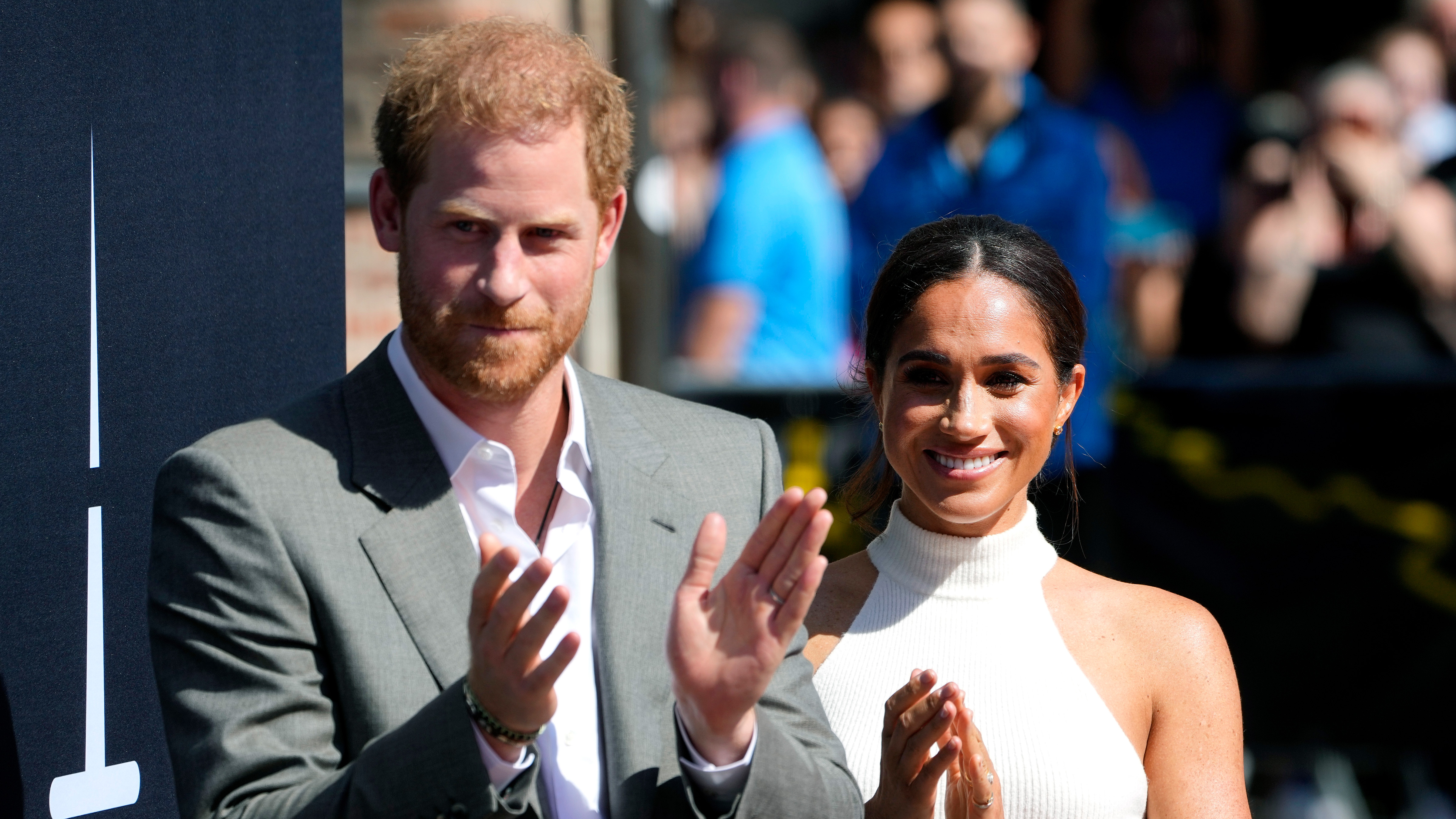 Britain's Prince Harry, left, and Meghan, Duchess of Sussex, arrive for a visit at the town hall in Duesseldorf, Germany on Sept. 6, 2022. 